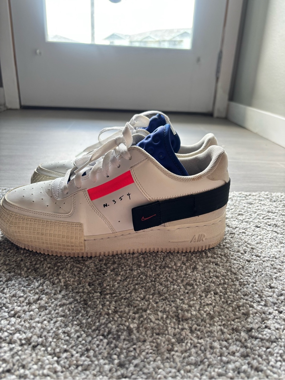Nike White Sneakers with Black Strap and Bright Pink Accent